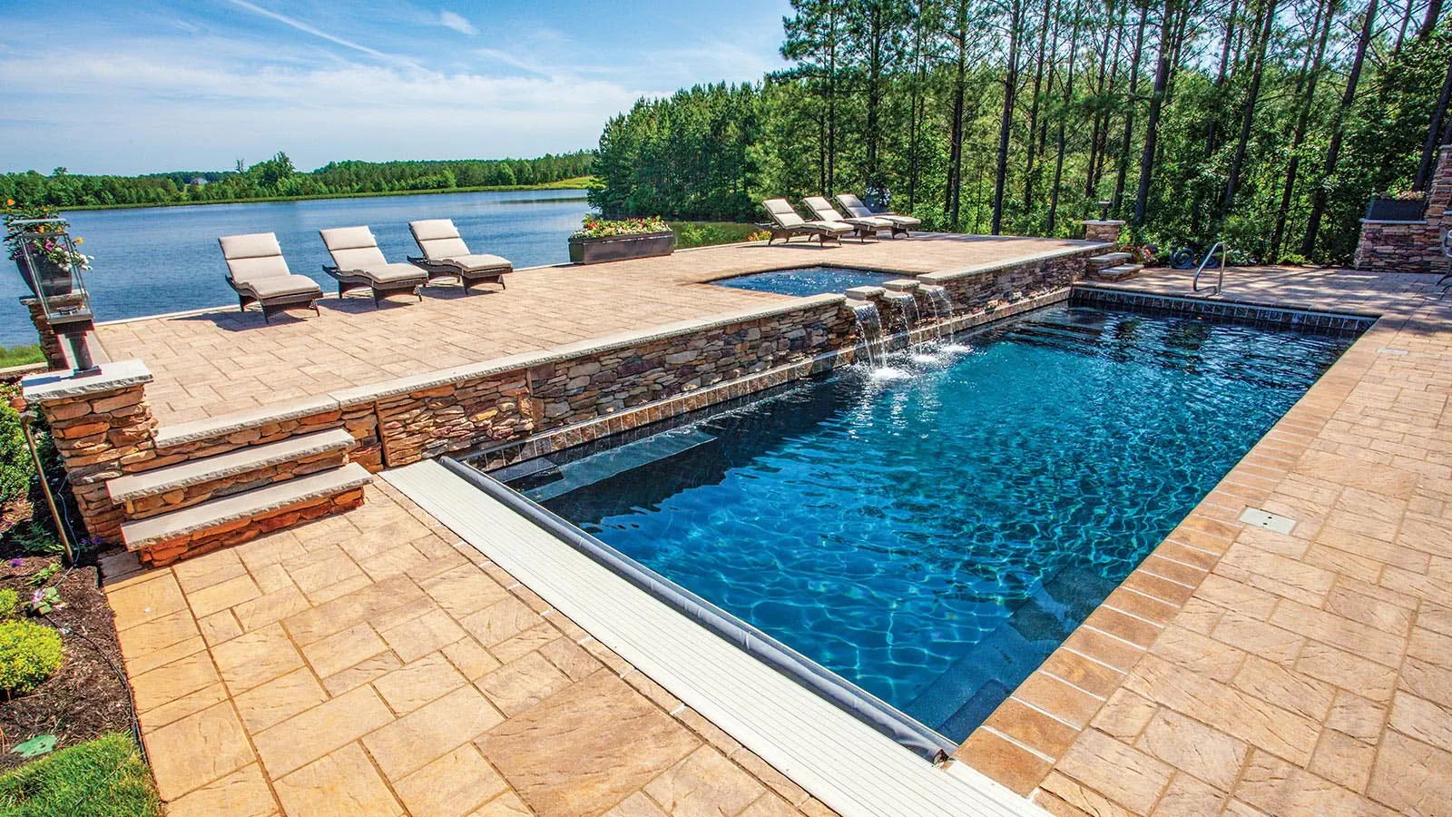 EbonyBlue_Hero A Leisure Pools outdoor swimming pool in Ebony Blue color